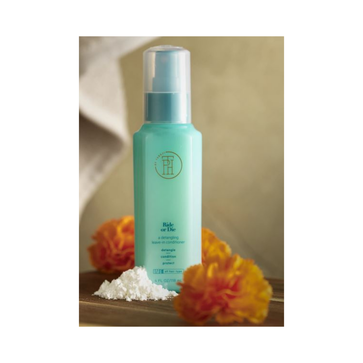 TPH by Taraji Ride or Die Leave-In Conditioner – A nourishing leave-in treatment with aloe vera, shea butter, and biotin to hydrate, detangle, and strengthen hair.