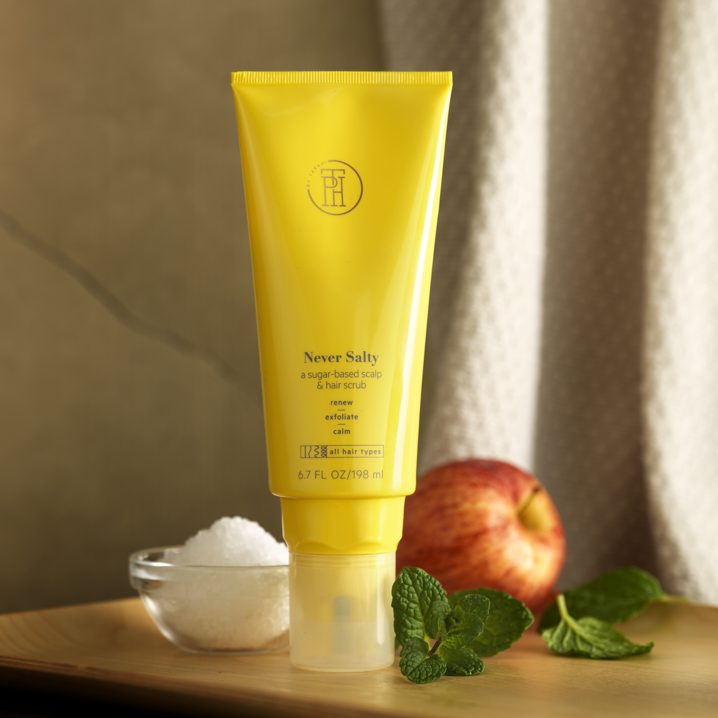 TPH by Taraji Never Salty Scalp Scrub – A sugar-based scalp exfoliator infused with apple cider vinegar and peppermint oil to cleanse, detoxify, and refresh the scalp.